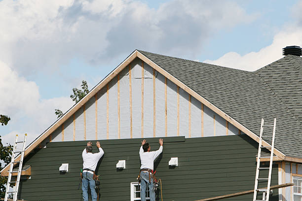 Professional Vinyl Siding technician working in Lawrence, MA